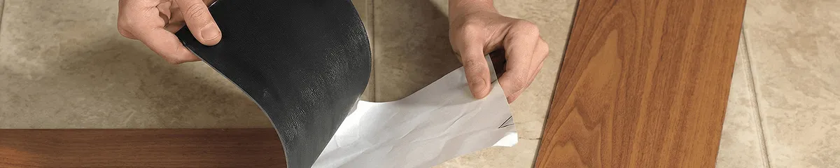 A professional installing vinyl flooring in Seattle, WA